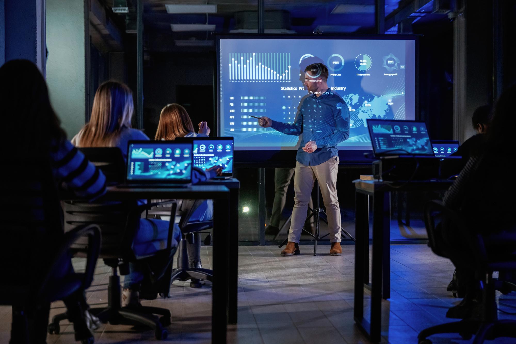 Team monitoring live metrics on screens